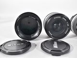 four different lens lenses sitting on top of each other on a table