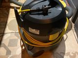 an image of a vacuum cleaner on the floor of a kitchen