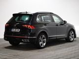 a black volkswagen suv parked on a checkered tile floor