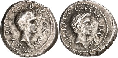 a silver coin with an image of a man ' s head on it