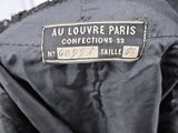a close up of a jacket with a label on the back of it