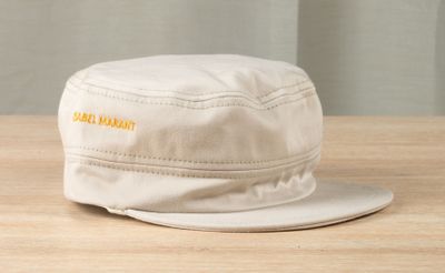 a white hat that is sitting on a wooden table