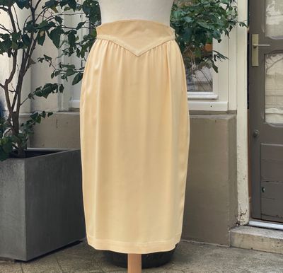 a mannequin on a mannequin stand in front of a door