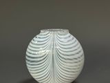 an image of a white vase sitting on top of a table