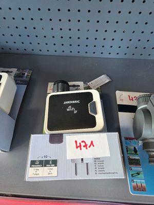 several electronic devices are on a shelf in a store