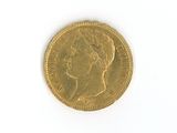 a gold coin with a picture of a woman on it