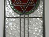 a stained glass window with a star of david on it