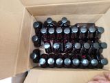 a box full of empty beer bottles sitting on a table