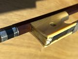 a close up of a wooden bow on a table
