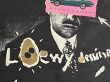 a poster of a man in a suit with a car on it