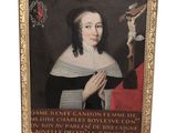 tableau représentant une femme tenant un crucifix, dans un cadre doré