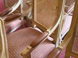 many chairs that are lined up in a row
