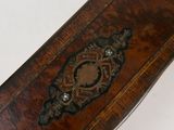 a wooden box with a decorative design on it