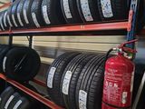 many tires on the shelves in the store