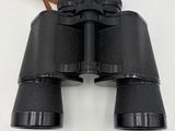 a close up of a pair of binoculars on a white surface