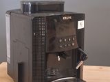 a coffee machine that is sitting on a wooden table