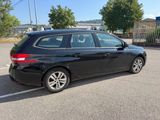 a picture of a black car parked in a parking lot