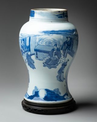 a blue and white vase sitting on a table