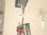 a couple of tools hanging on a wall in a room