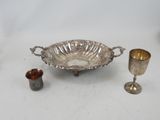 silver plated bowl and cups on a table with a white background