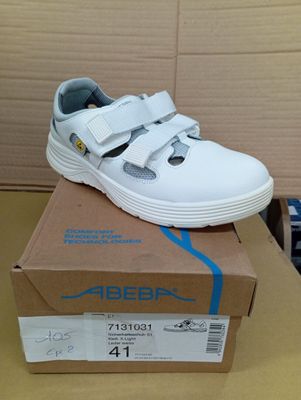 a white shoe that is on top of a box