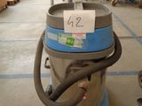 a machine that is sitting on a cart in a warehouse