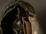 a close up of a baseball glove with a leather strap