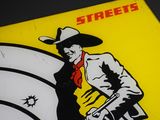 une photo d'un panneau sur lequel figure un cow-boy