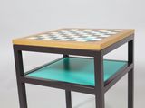 a small table with a chess board on top of it