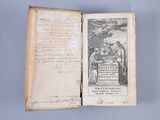 an open book with a drawing of a man and a woman on it