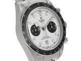 a close up of a wrist watch with a white dial
