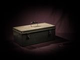 a black box with a handle on a purple background