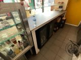 a man that is standing in front of a counter