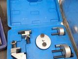a blue case with tools in it sitting on the floor