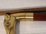 two canes and a cane holder on a table