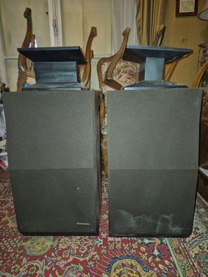 two speakers that are sitting on a carpet