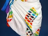 a close up of a dress with a colorful design on it