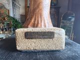 a statue of a woman that is sitting on top of a table