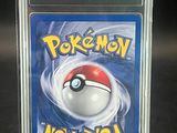 a close up of a pokemon card in a plastic case