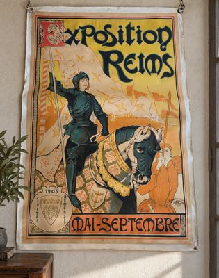 an old poster hangs on the wall of a room with a plant