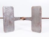 an image of a pair of metal tools sitting on top of a white surface