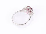 a pink tourmaline and diamond ring on a white background