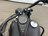 a close up of a motorcycle with a speedometer on the handlebar