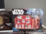 star wars action figures are on display in a display case