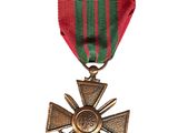 an image of a medal with a cross on a ribbon