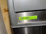 an image of a machine that has a yellow sticker on it