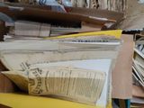 a box full of old papers and papers on a table