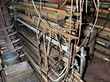 a room with a bunch of pipes and a bunch of wires