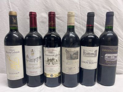 several bottles of wine are lined up on a table