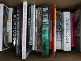 many books that are in a box on the table